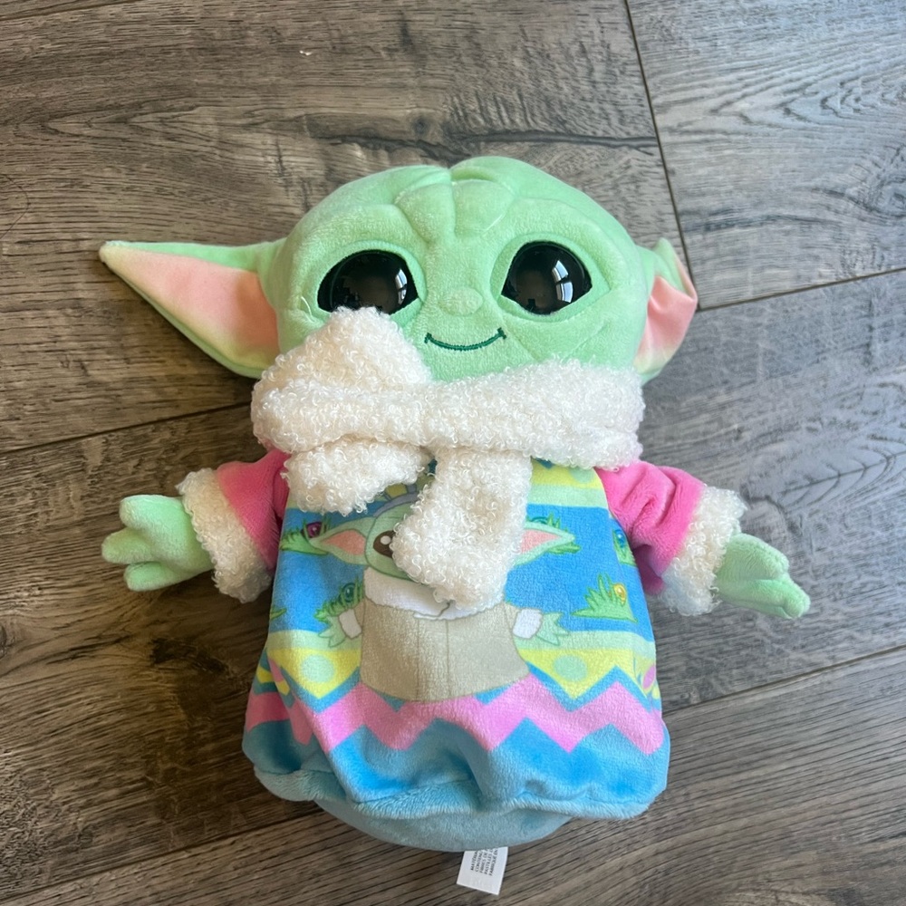 Green Plush Toy with Colorful Outfit